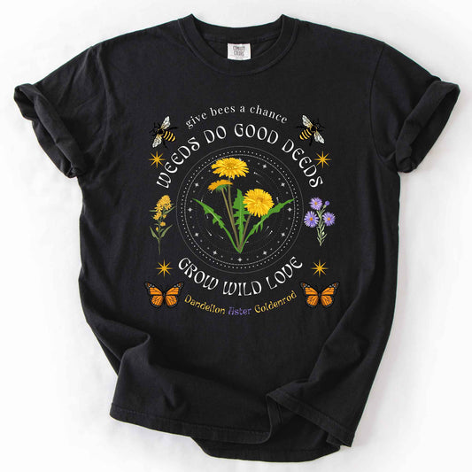 Black "Weeds Do Good Deeds, Grow Wild Love" t-shirt on Comfort Colors tee, featuring dandelions, goldenrod, and aster wildflowers with bees and monarch butterflies in a celestial circle design. Gardener and pollinator lover gift shirt for wildflower and native plant enthusiasts.