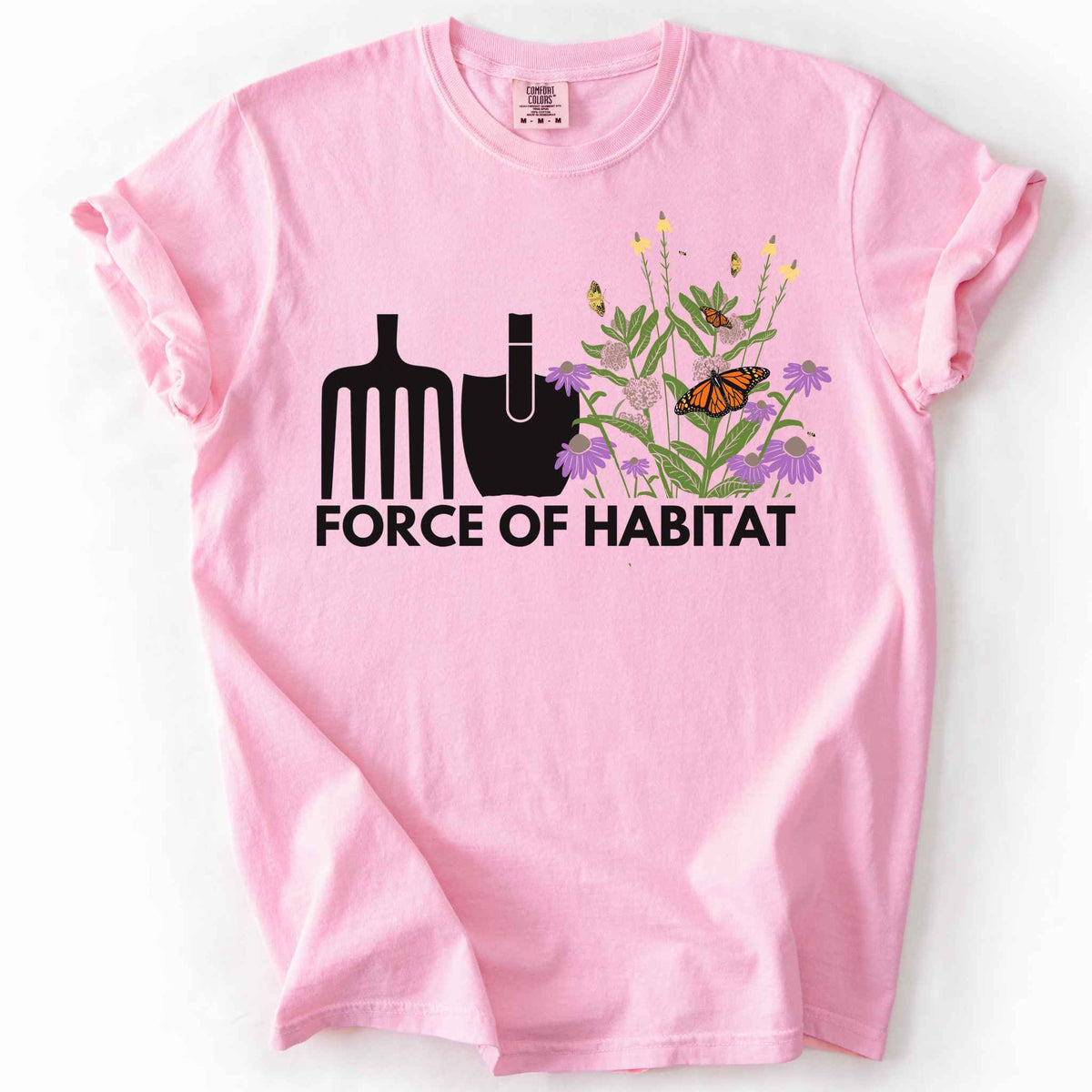 Blossom Force of Habitat" t-shirt on Comfort Colors tee, featuring simple garden tool graphics beside a coneflower and milkweed patch with monarch and fritillary butterflies. Gardener and native plant gift shirt for pollinator conservation fans.