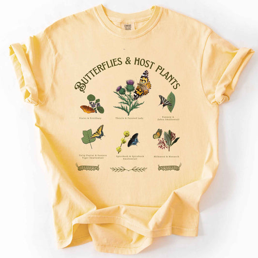 Butter colored "Butterflies & Host Plants" t-shirt on Comfort Colors tee, featuring six graphic designed butterfly and plant pairings including Monarch on Milkweed, Painted Lady on Thistle, and Eastern Tiger Swallowtail on Tulip Poplar. Botanical gift shirt for butterfly gardeners and nature lovers.