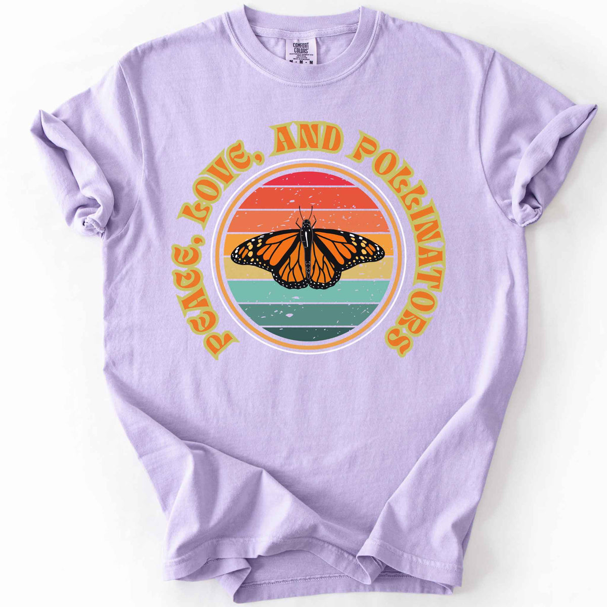 Orchid "Peace, Love, and Pollinators" t-shirt on Comfort Colors tee, featuring a monarch butterfly against a retro rainbow sunset circle design. Butterfly gardener and native plant gift shirt for pollinator conservation fans.