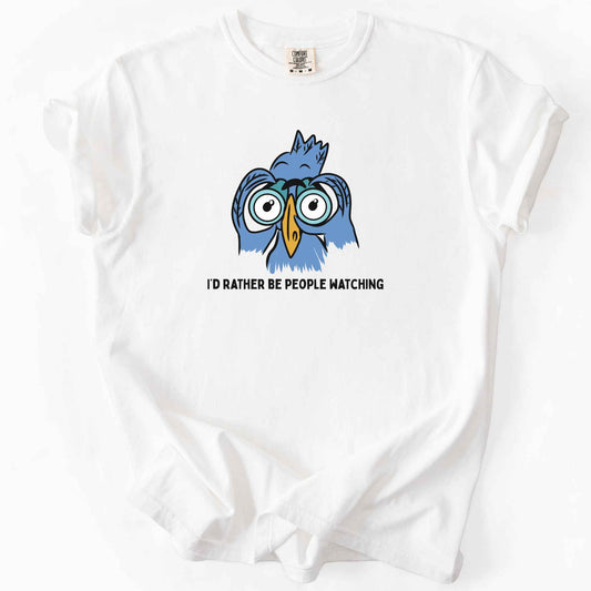 White "I'd Rather Be People Watching" t-shirt on Comfort Colors tee, featuring a cartoon blue bird holding binoculars up to its eyes. Funny birdwatcher gift shirt for bird lovers and introverts.