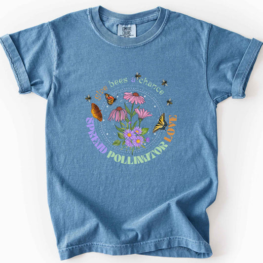 Blue jean "Give Bees a Chance, Spread Pollinator Love" kids t-shirt on Comfort Colors tee, featuring colorful wildflowers, bees, and butterflies in a celestial circle design, gardener and nature lover gift shirt for bee and pollinator conservation fans.