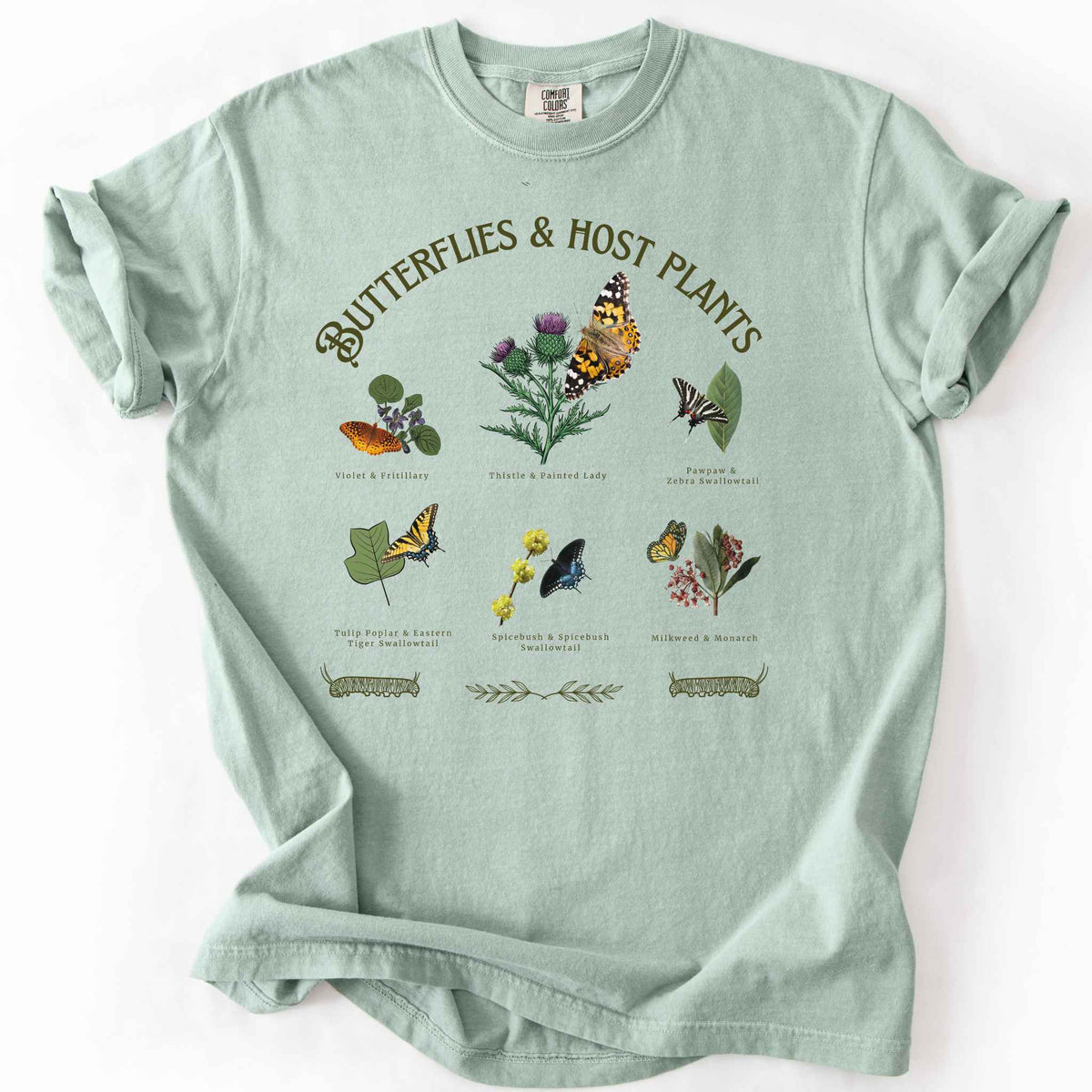 Bay "Butterflies & Host Plants" t-shirt on Comfort Colors tee, featuring six graphic designed butterfly and plant pairings including Monarch on Milkweed, Painted Lady on Thistle, and Eastern Tiger Swallowtail on Tulip Poplar. Botanical gift shirt for butterfly gardeners and nature lovers.