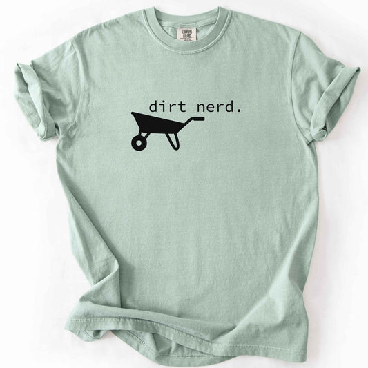 Bay "Dirt Nerd" t-shirt on Comfort Colors tee, featuring a simple black wheelbarrow icon with minimalist typewriter style text. Funny gardener gift shirt for plant lovers and landscaping enthusiasts.