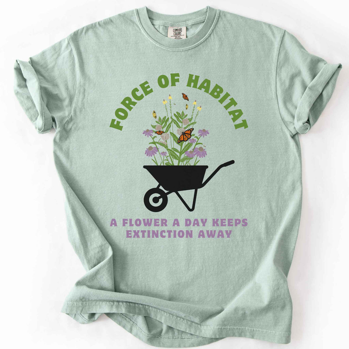Bay "Force of Habitat, A Flower a Day Keeps Extinction Away" t-shirt on Comfort Colors tee, featuring a wheelbarrow overflowing with coneflowers and monarch butterflies. Gardener and native plant gift shirt for pollinator conservation and habitat restoration fans.