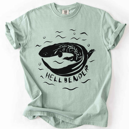 Bay "Hellbender" t-shirt on Comfort Colors tee, featuring a bold graphic of a curled hellbender salamander surrounded by stylized water splashes and bubbles. Amphibian and herpetology lover gift shirt for salamander and wildlife enthusiasts.