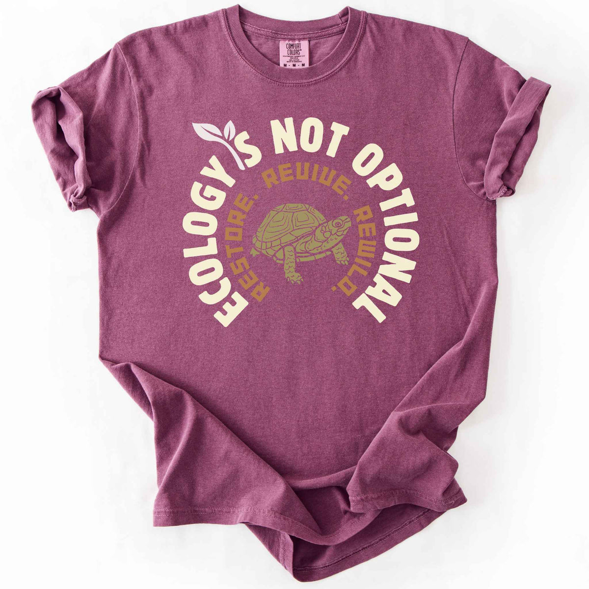 Berry "Ecology Is Not Optional, Restore, Revive, Rewild" t-shirt on Comfort Colors tee, featuring a box turtle illustration within a circular design. Conservation and reptile lover gift shirt for ecologists and wildlife enthusiasts.