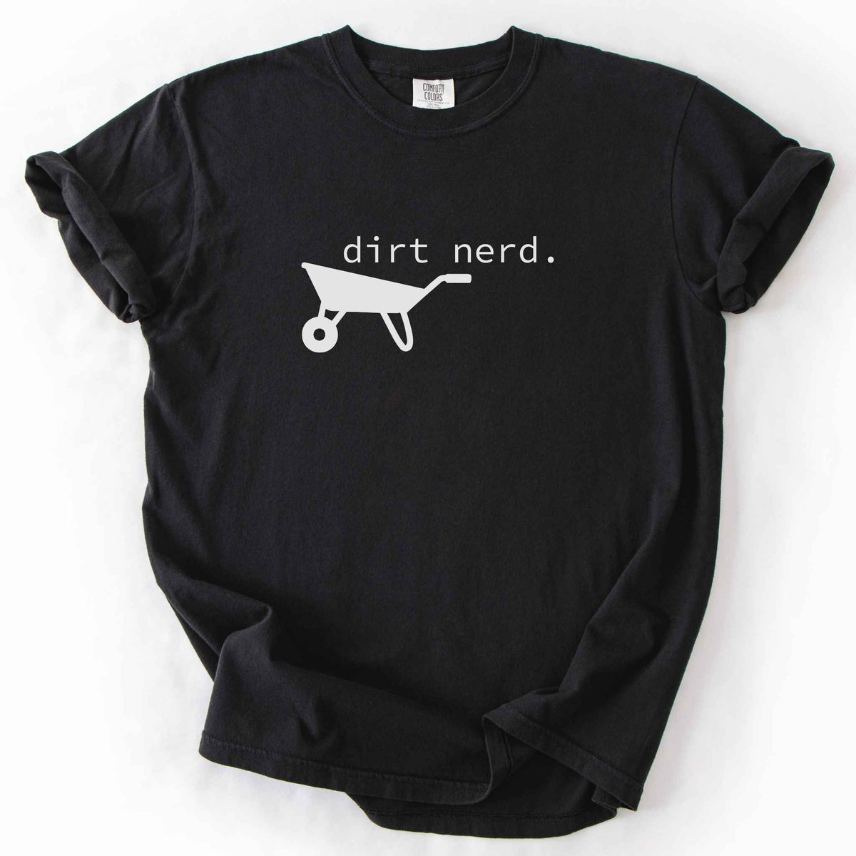 Black "Dirt Nerd" t-shirt on Comfort Colors tee, featuring a simple black wheelbarrow icon with minimalist typewriter style text. Funny gardener gift shirt for plant lovers and landscaping enthusiasts.
