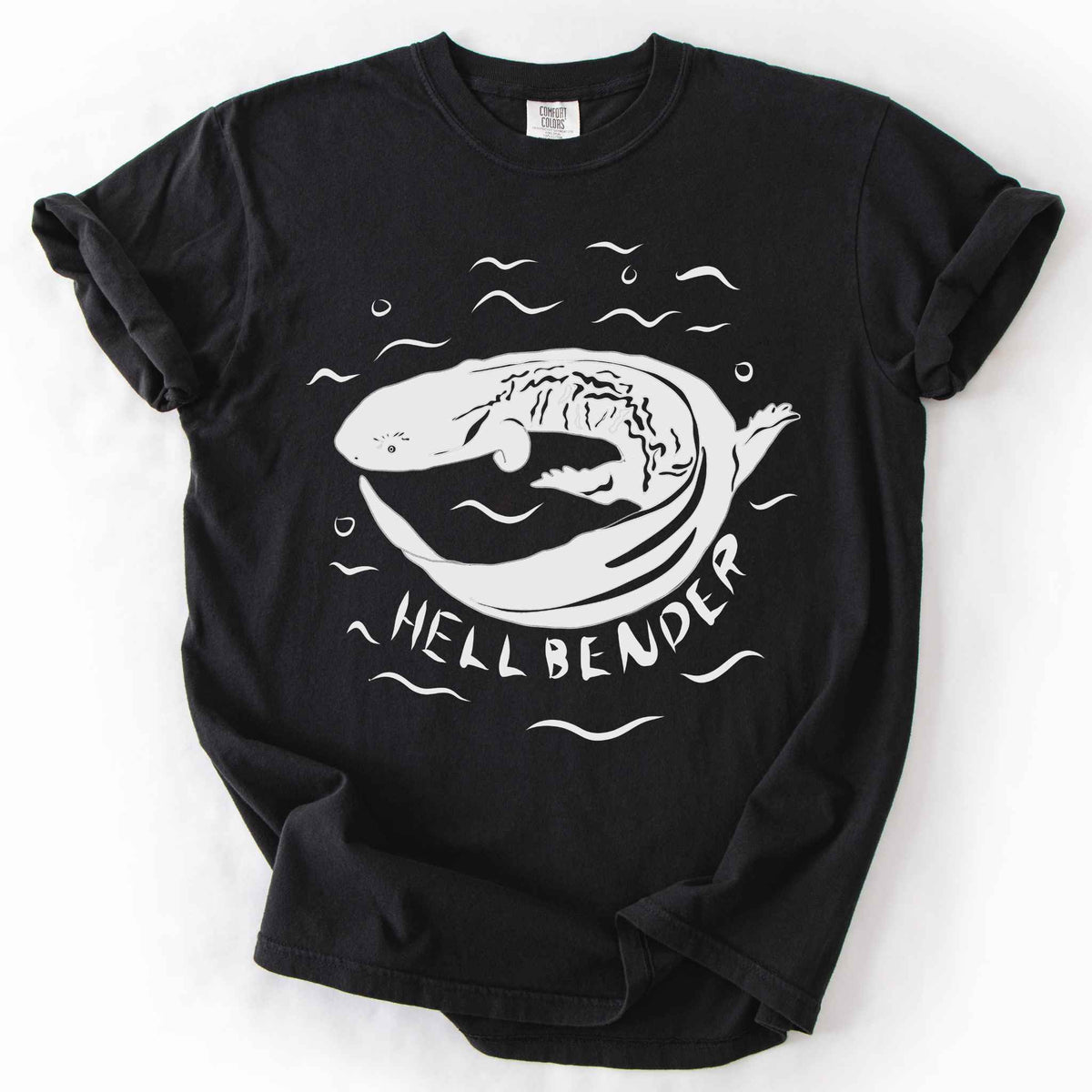 Black "Hellbender" t-shirt on Comfort Colors tee, featuring a bold graphic of a curled hellbender salamander surrounded by stylized water splashes and bubbles. Amphibian and herpetology lover gift shirt for salamander and wildlife enthusiasts.