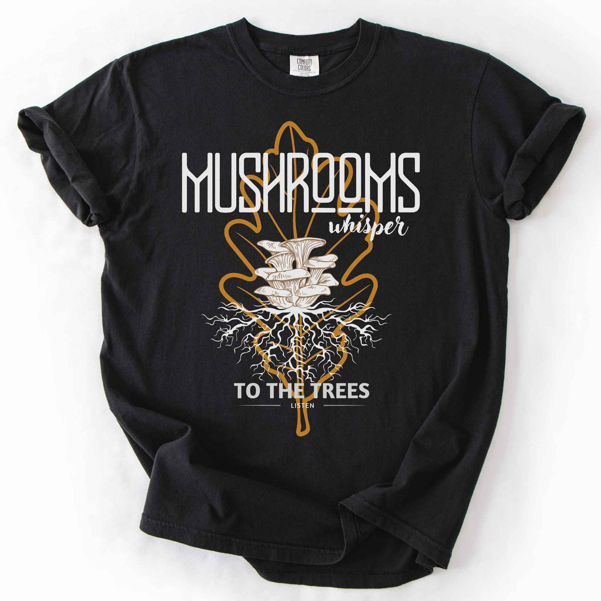 Black "Mushrooms Whisper to the Trees, Listen" t-shirt on Comfort Colors tee, featuring mushrooms growing from a mycelium root system inside a golden leaf outline. Mycology and forest lover gift shirt for foragers and mushroom enthusiasts.