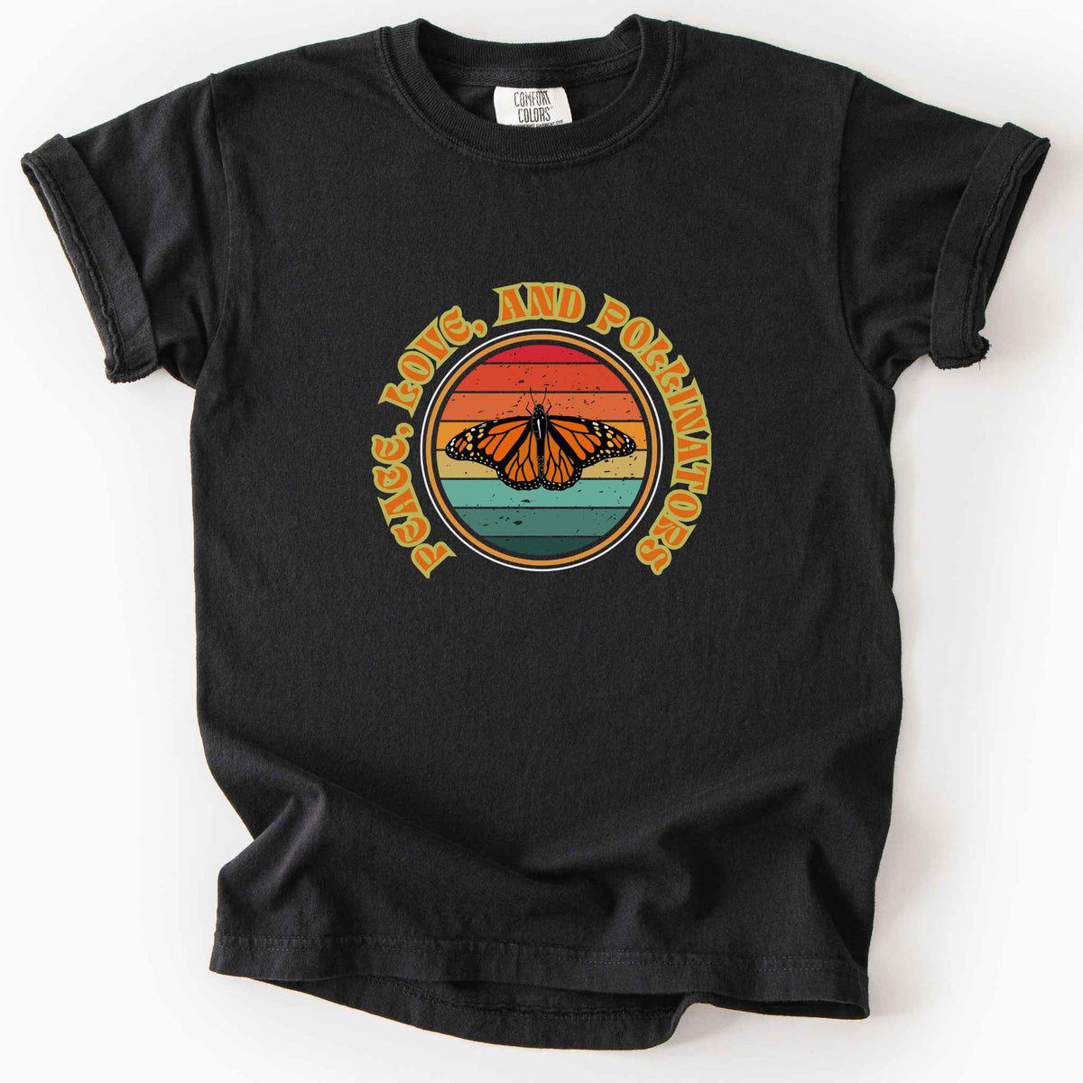 Black "Peace, Love, and Pollinators" kids t-shirt on Comfort Colors tee, featuring a monarch butterfly against a retro rainbow sunset circle design. Butterfly gardener and native plant gift shirt for pollinator conservation fans.