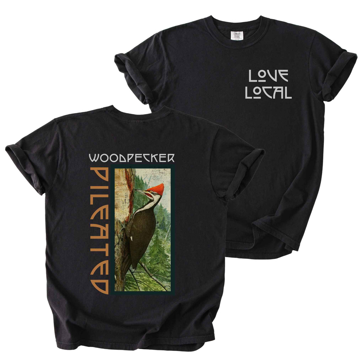 Black "Pileated Woodpecker, Love Local" t-shirt on Comfort Colors tee, featuring a small front chest logo and a full vintage style back print of a woodpecker on a tree in a forest setting. Birdwatcher gift shirt for wildlife and nature enthusiasts.