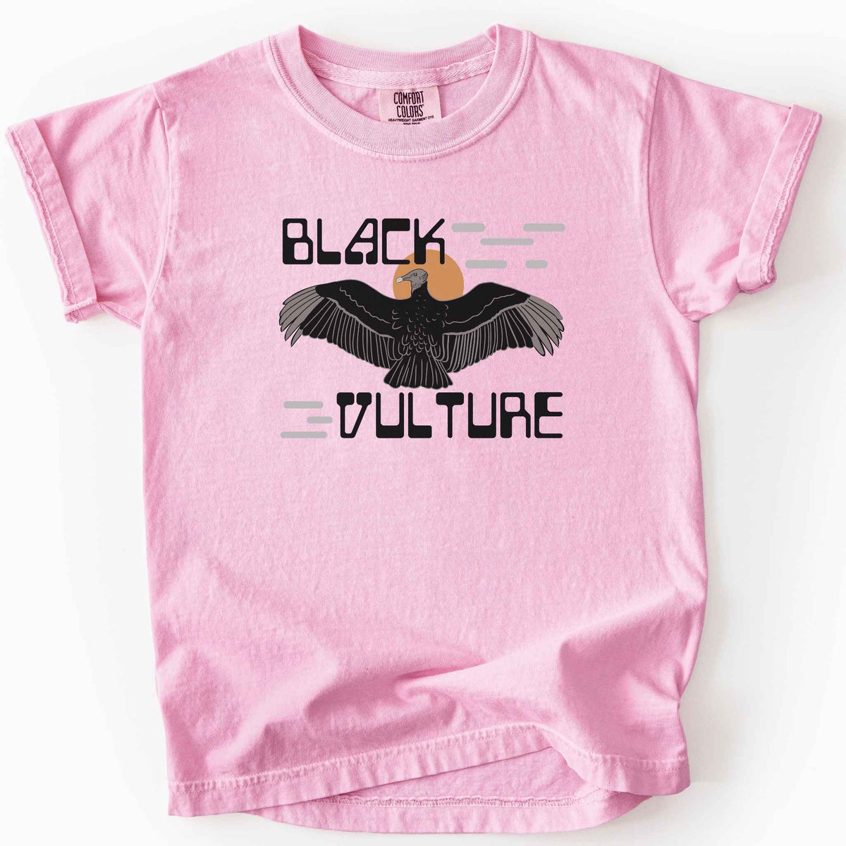 Blossom "Black Vulture" kids t-shirt on Comfort Colors tee, featuring a vulture with spread wings against an orange sun with bold geometric lettering. Birdwatcher and scavenger lover gift shirt for wildlife and nature enthusiasts.