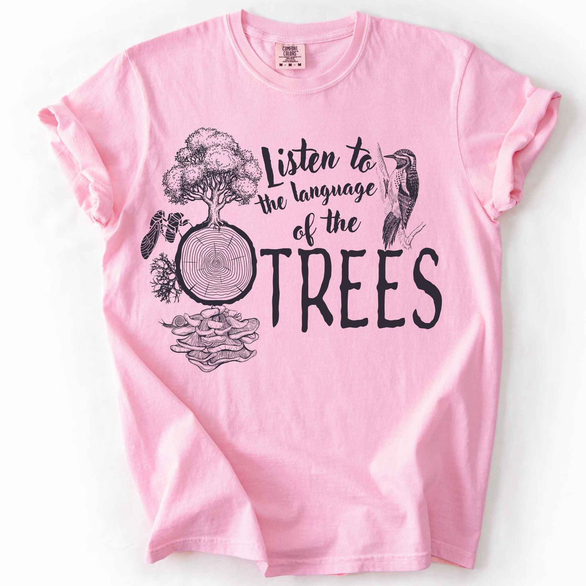 Blossom "Listen to the Language of the Trees" t-shirt on Comfort Colors tee, featuring a tree, tree rings, woodpecker, cicada, and mushrooms in white. Nature lover and forest ecology gift shirt for tree huggers and outdoor enthusiasts.