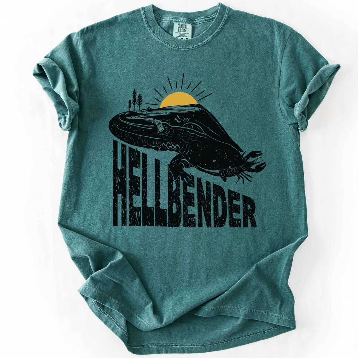 Blue spruce "Hellbender a body of water" t-shirt on Comfort Colors tee, featuring a bold black graphic of a hellbender salamander eating a crayfish with a river landscape etched into its body. Amphibian and herpetology lover gift shirt for salamander and river conservation enthusiasts.
