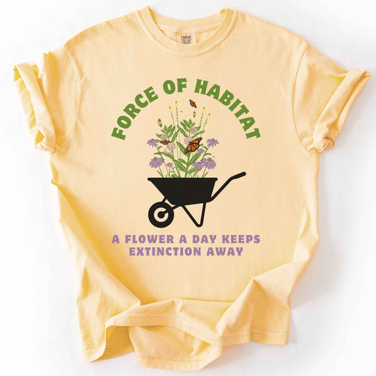 Butter "Force of Habitat, A Flower a Day Keeps Extinction Away" t-shirt on Comfort Colors tee, featuring a wheelbarrow overflowing with coneflowers and monarch butterflies. Gardener and native plant gift shirt for pollinator conservation and habitat restoration fans.