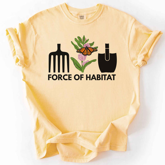 Butter "Force of Habitat: monarch" t-shirt on Comfort Colors tee, featuring garden tool graphics flanking a hand-drawn monarch butterfly on milkweed flowers with bold black text below. Gardener and native plant gift shirt for pollinator conservation fans.