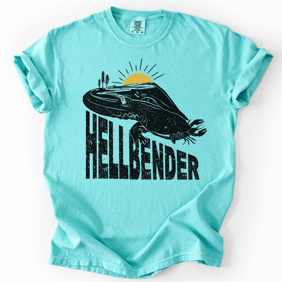 Chalky Mint "Hellbender a body of water" t-shirt on Comfort Colors tee, featuring a bold black graphic of a hellbender salamander eating a crayfish with a river landscape etched into its body. Amphibian and herpetology lover gift shirt for salamander and river conservation enthusiasts.