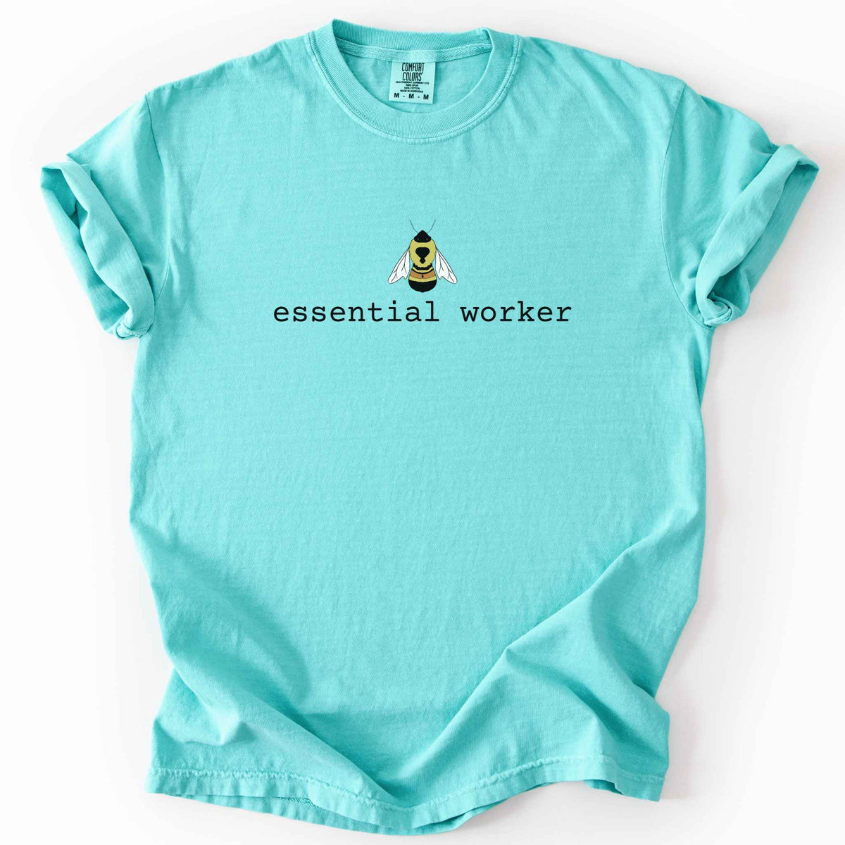 Chalky mint "Essential Worker" t-shirt on Comfort Colors tee, featuring a small illustrated rusty patch bumblebee above simple typewriter style text. Funny bee lover and pollinator gift shirt for beekeepers and nature enthusiasts.