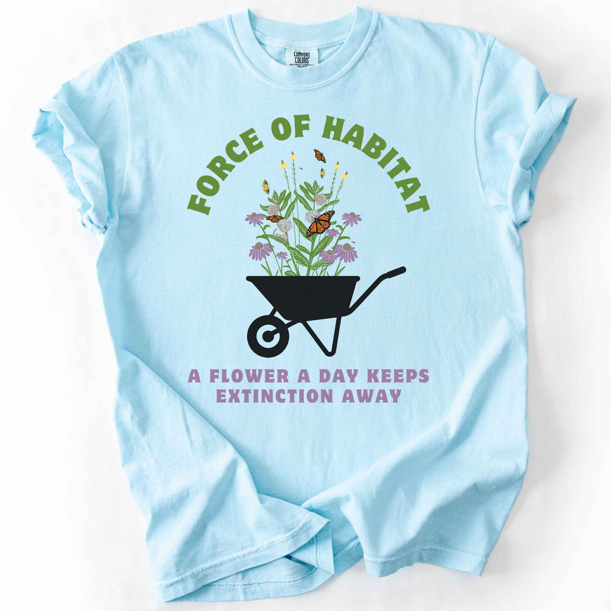 Chambray "Force of Habitat, A Flower a Day Keeps Extinction Away" t-shirt on Comfort Colors tee, featuring a wheelbarrow overflowing with coneflowers and monarch butterflies. Gardener and native plant gift shirt for pollinator conservation and habitat restoration fans.