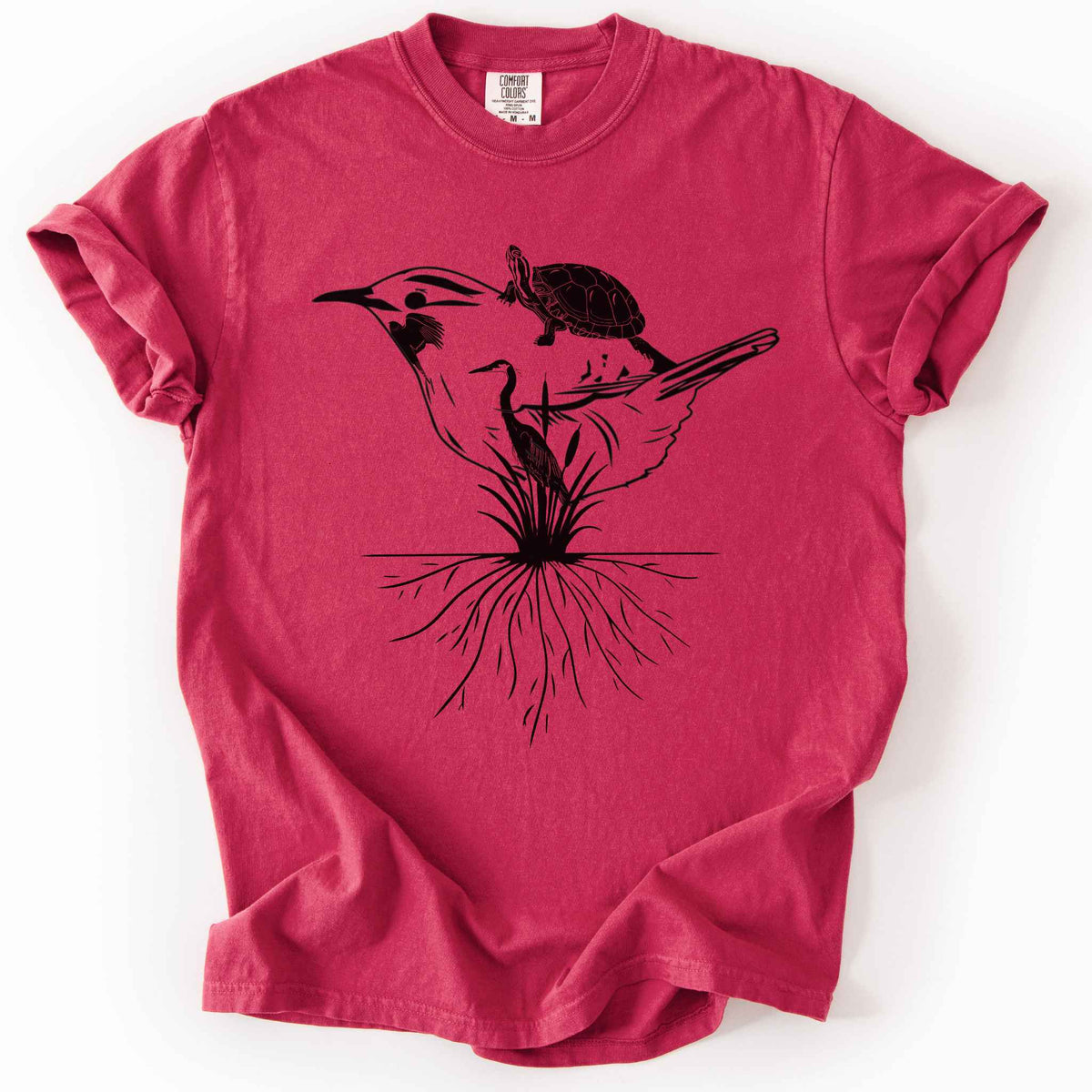 Chili "Marhlands Matter" t-shirt on Comfort Colors tee, featuring a surreal black line art style design blending a bird, turtle, heron, and cattail roots into one flowing wetland scene. Nature lover and wetland conservation gift shirt for birdwatching and wildlife enthusiasts.