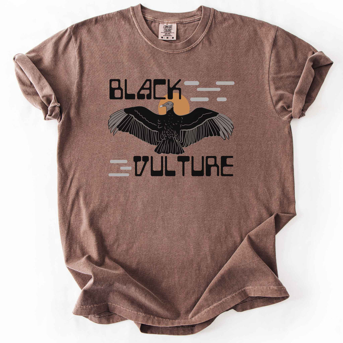 Espresso "Black Vulture" t-shirt on Comfort Colors tee, featuring a vulture with spread wings against an orange sun with bold geometric lettering. Birdwatcher and scavenger lover gift shirt for wildlife and nature enthusiasts.