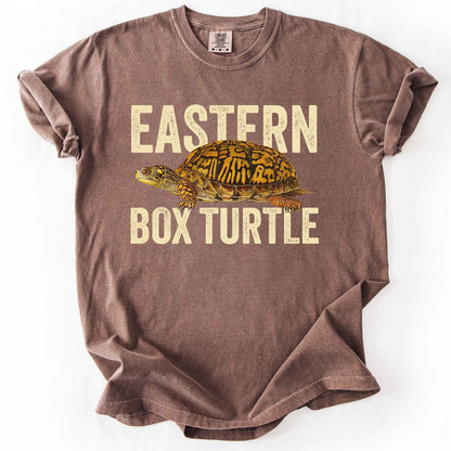 Espresso "Eastern Box Turtle" t-shirt on Comfort Colors tee, featuring a detailed vintage style turtle graphic with cream bold block lettering. Reptile lover and turtle enthusiast gift shirt for wildlife and nature fans.