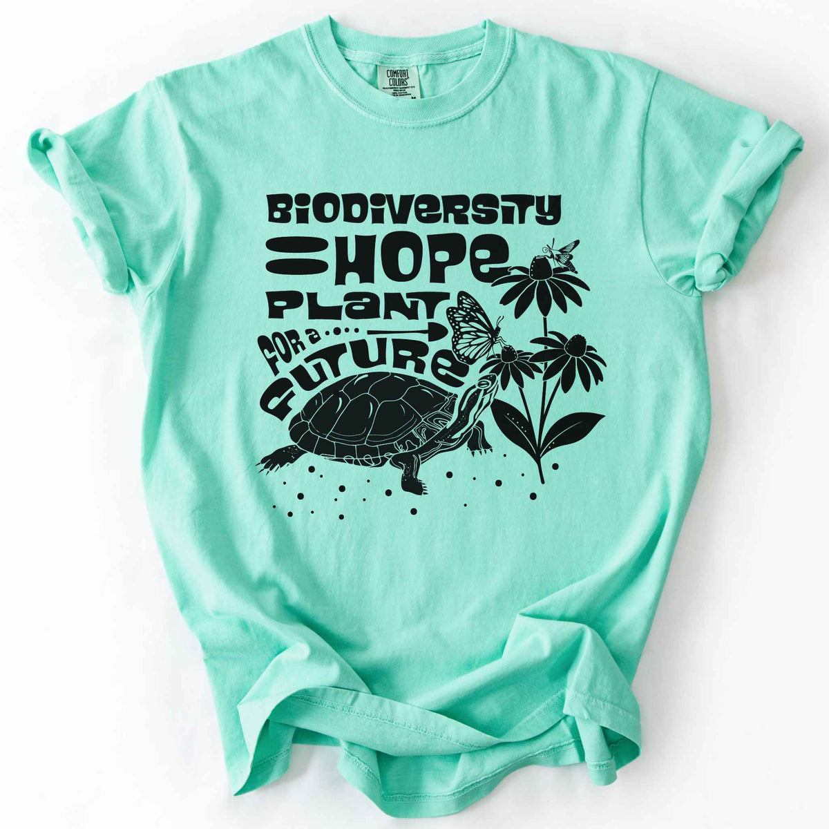 Island reef "Biodiversity Hope, Plant for a Future" t-shirt on Comfort Colors tee, featuring a black graphic of a turtle with monarch butterflies on coneflowers in bold groovy lettering. Conservation and native plant gift shirt for wildlife and biodiversity enthusiasts.