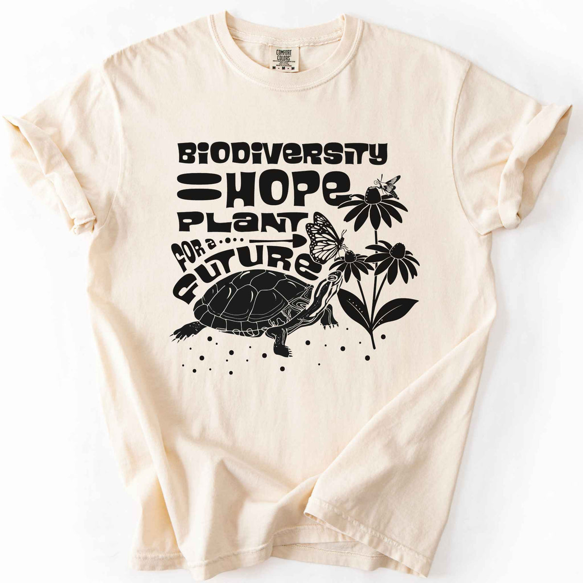 Ivory "Biodiversity Hope, Plant for a Future" t-shirt on Comfort Colors tee, featuring a black graphic of a turtle with monarch butterflies on coneflowers in bold groovy lettering. Conservation and native plant gift shirt for wildlife and biodiversity 