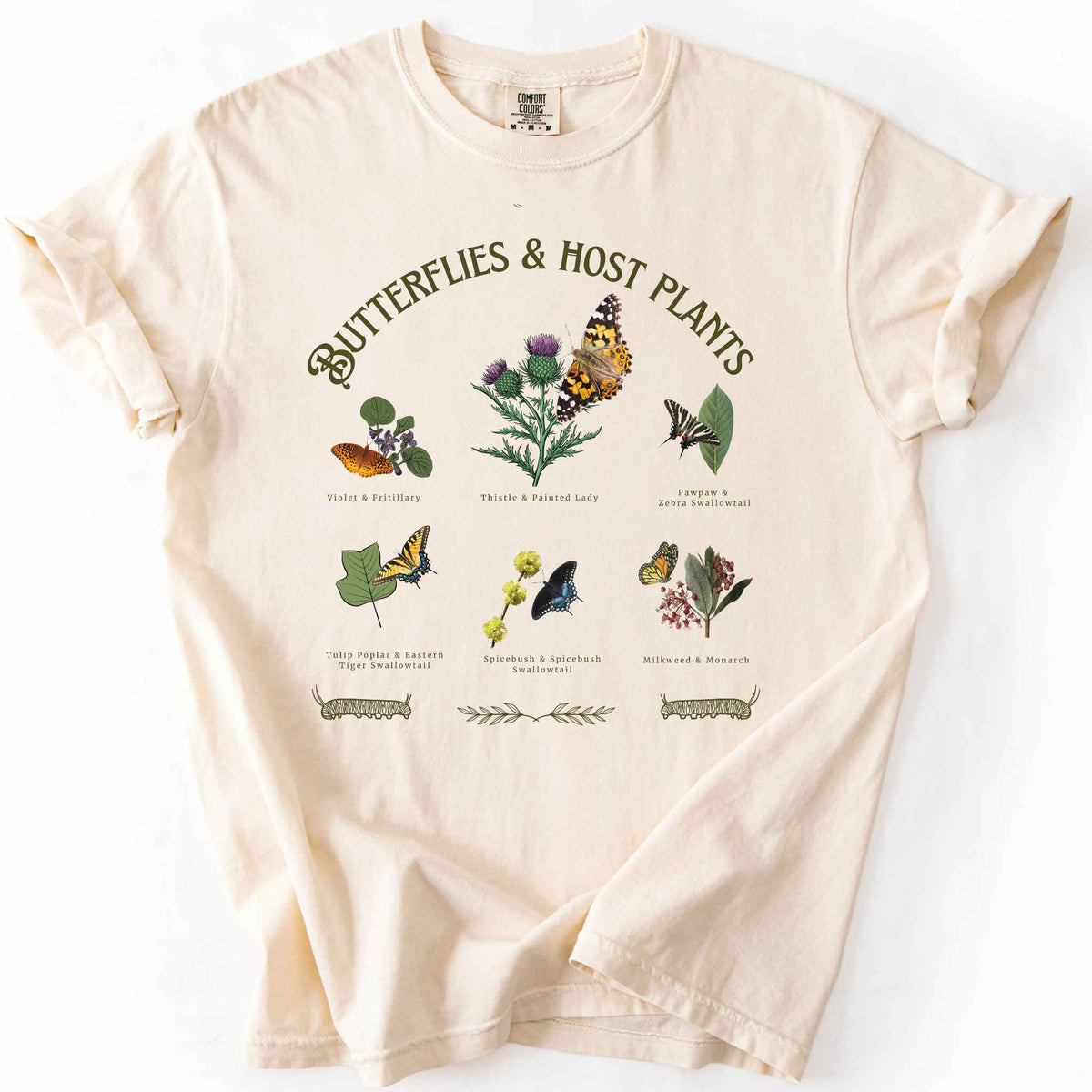 Ivory "Butterflies & Host Plants" t-shirt on Comfort Colors tee, featuring six graphic designed butterfly and plant pairings including Monarch on Milkweed, Painted Lady on Thistle, and Eastern Tiger Swallowtail on Tulip Poplar. Botanical gift shirt for butterfly gardeners and nature lovers.