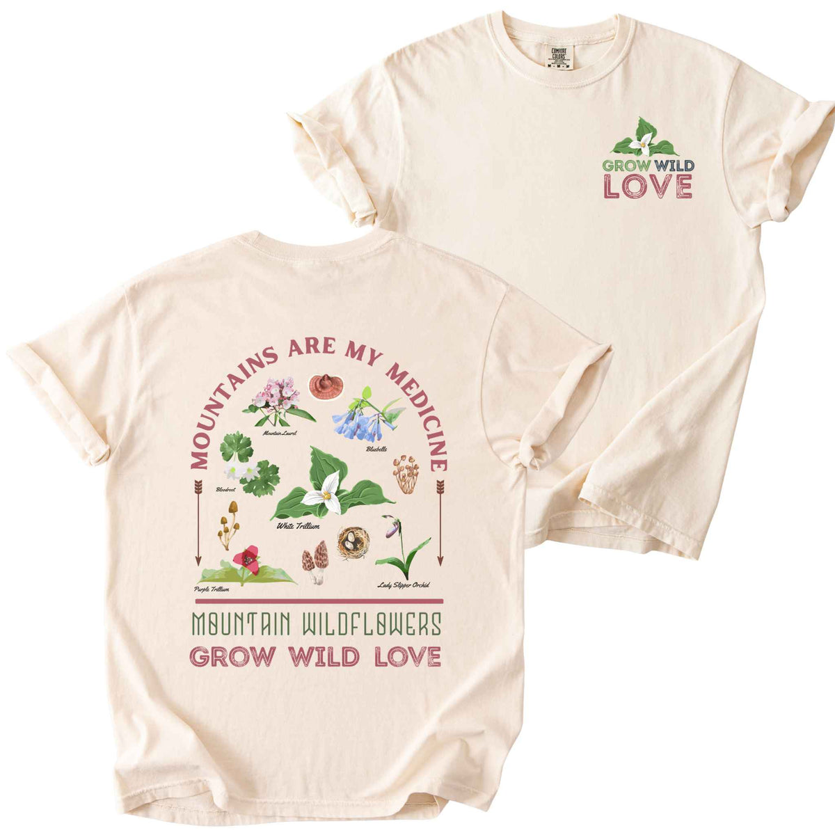 Ivory "Mountains Are My Medicine, Mountain Wildflowers, Grow Wild Love" t-shirt on Comfort Colors tee, featuring a small front chest logo and a full illustrated back print of labeled wildflowers and mushrooms including Trillium, Bluebells, and Lady Slipper Orchid. Botanical gift shirt for hikers and wildflower enthusiasts.