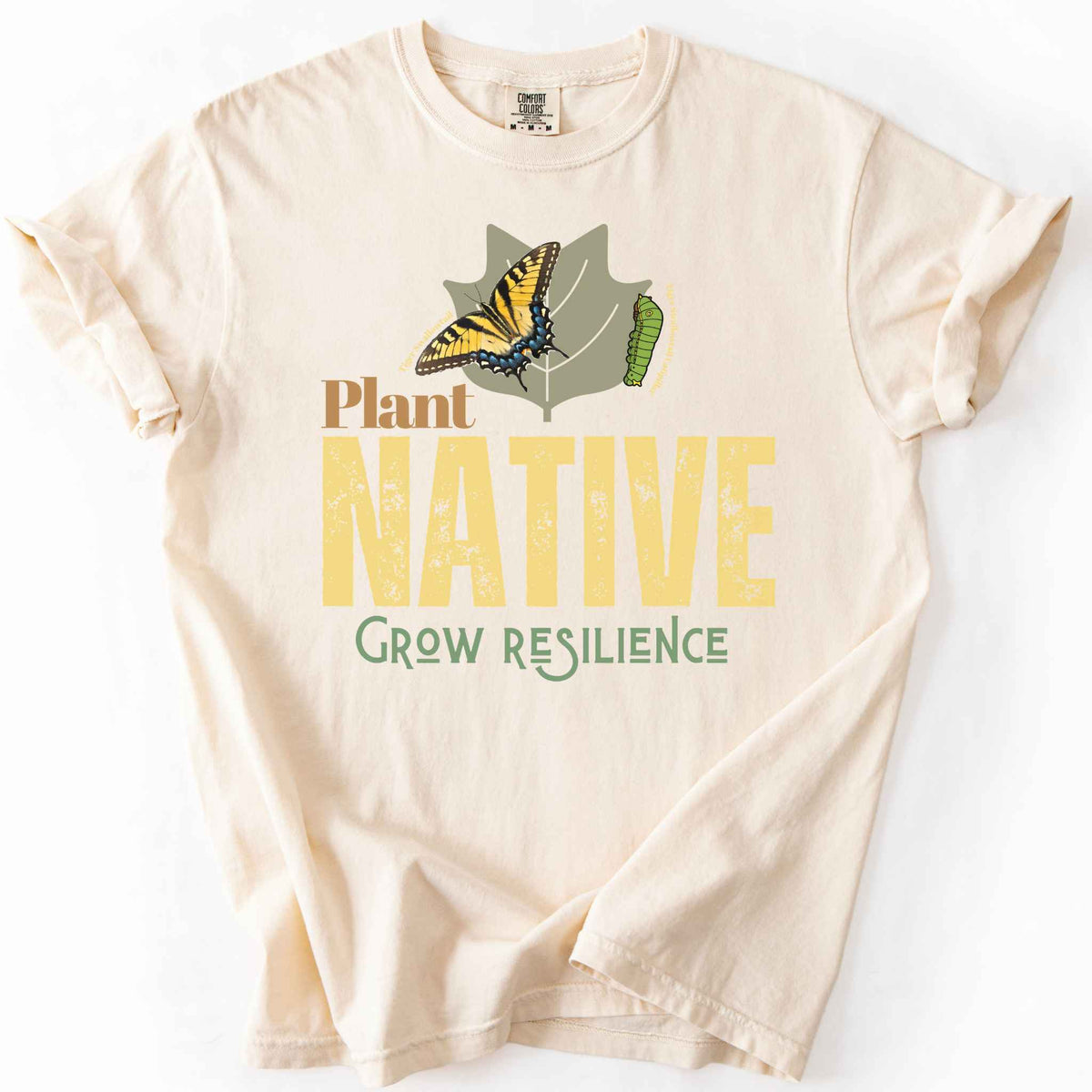 Ivory "Plant Native, Grow Resilience" t-shirt on Comfort Colors tee, featuring a Tiger Swallowtail butterfly and caterpillar on a leaf with bold distressed lettering. Gardener and native plant gift shirt for butterfly and pollinator conservation fans.