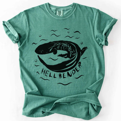 Light Green "Hellbender" t-shirt on Comfort Colors tee, featuring a bold graphic of a curled hellbender salamander surrounded by stylized water splashes and bubbles. Amphibian and herpetology lover gift shirt for salamander and wildlife enthusiasts.
