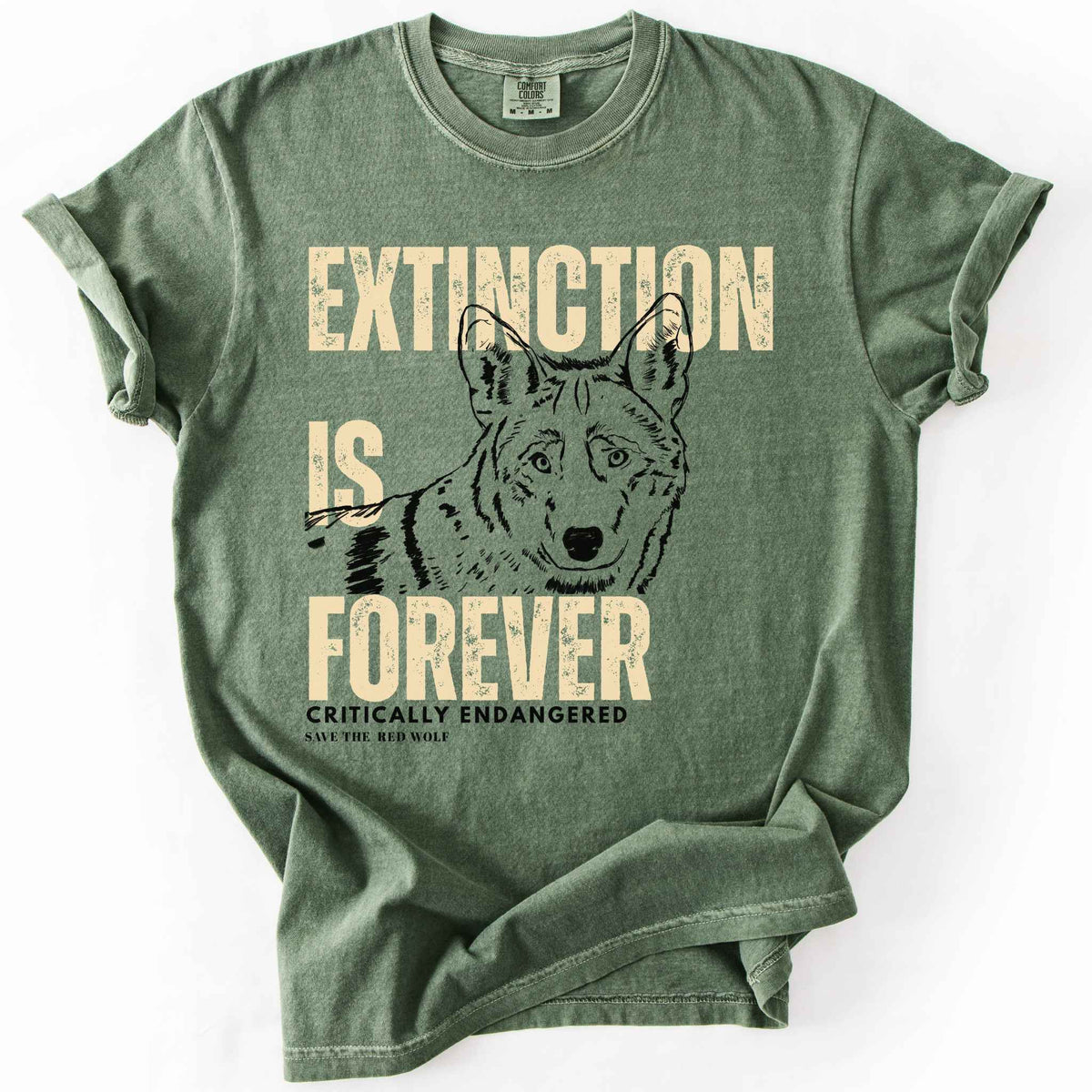Moss "Extinction Is Forever, Critically Endangered, Save the Red Wolf" t-shirt on Comfort Colors tee, featuring a hand drawn wolf portrait with bold cream distressed lettering. Conservation and wildlife gift shirt for wolf and endangered species advocates.