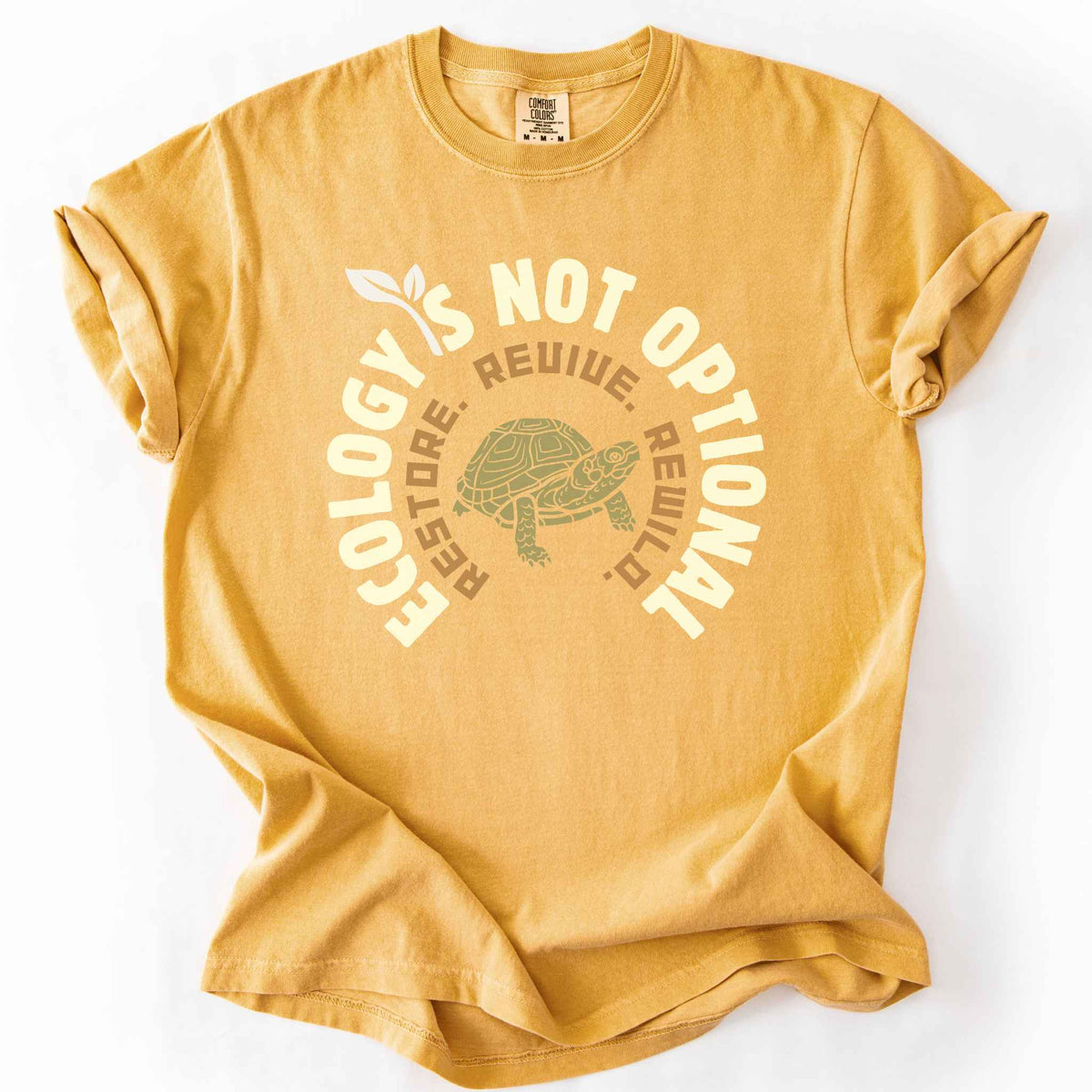 Mustard "Ecology Is Not Optional, Restore, Revive, Rewild" t-shirt on Comfort Colors tee, featuring a box turtle illustration within a circular design. Conservation and reptile lover gift shirt for ecologists and wildlife enthusiasts.