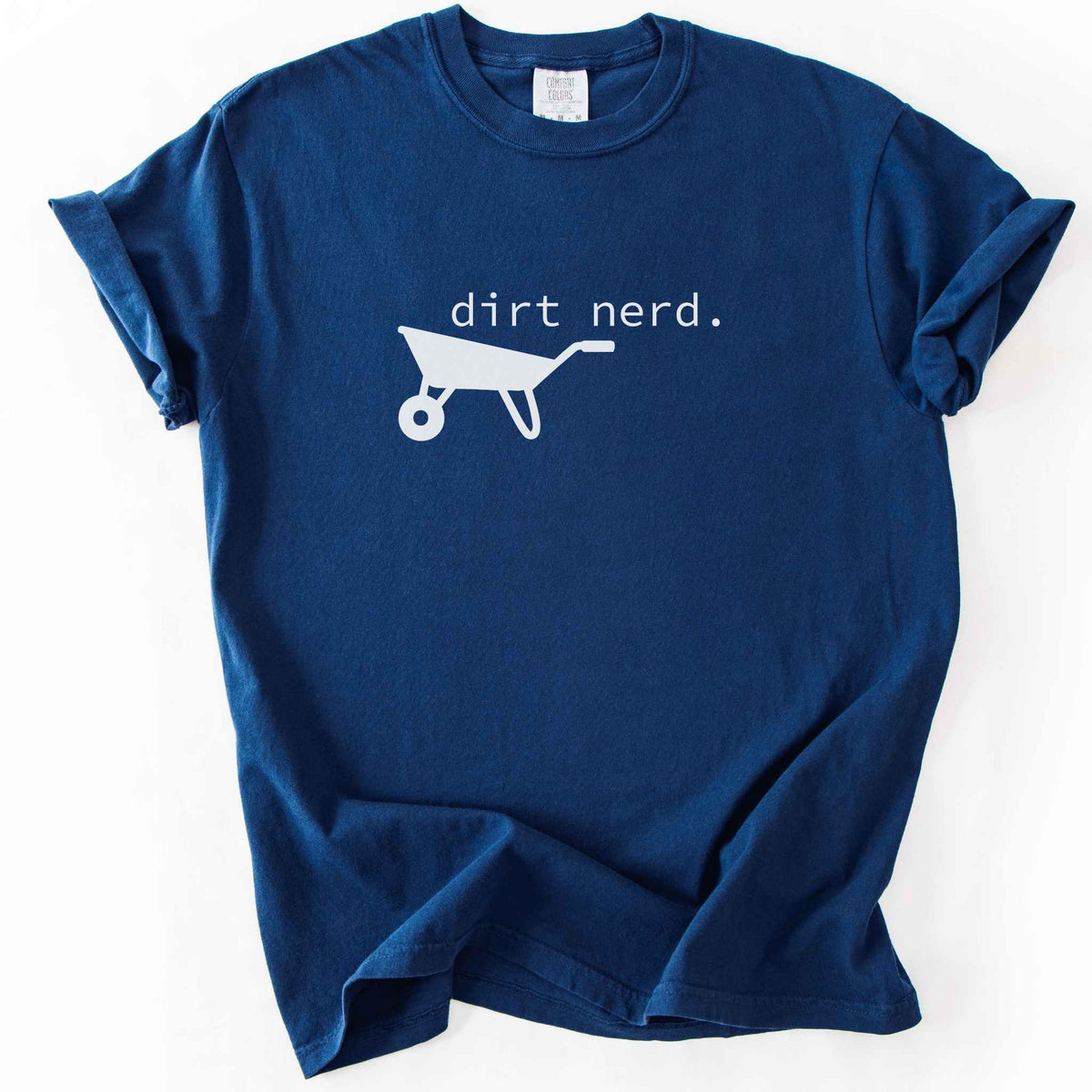 Navy "Dirt Nerd" t-shirt on Comfort Colors tee, featuring a simple black wheelbarrow icon with minimalist typewriter style text. Funny gardener gift shirt for plant lovers and landscaping enthusiasts.