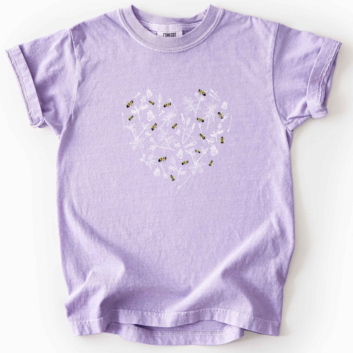 Orchid "Rusty Patch Bumblebee" kids t-shirt on Comfort Colors tee, featuring a heart shaped arrangement of hand-drawn white wildflowers, garden tools, butterflies, and colorful bees. Gardener and pollinator lover gift shirt for bee conservation and nature enthusiasts.