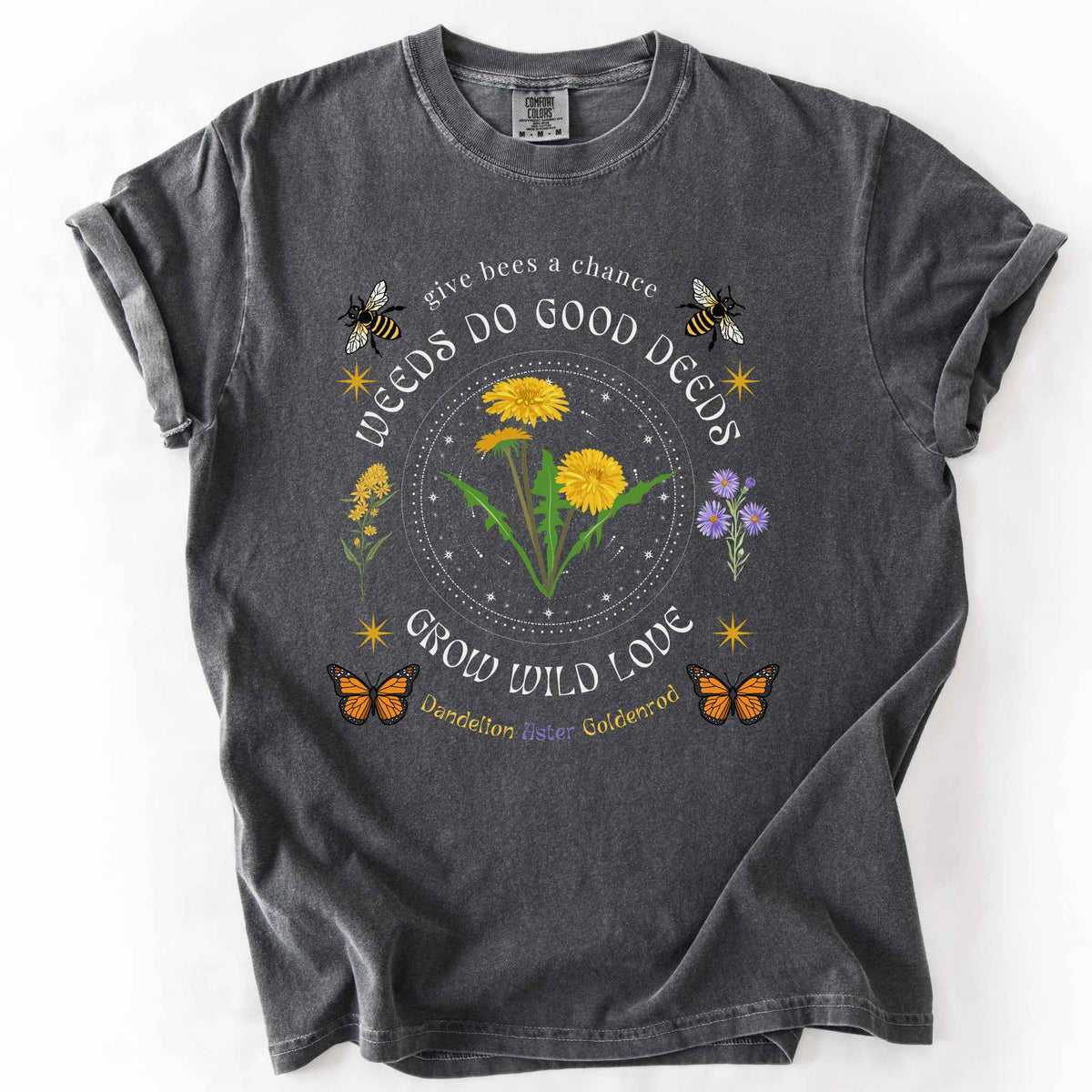 Pepper "Weeds Do Good Deeds, Grow Wild Love" t-shirt on Comfort Colors tee, featuring dandelions, goldenrod, and aster wildflowers with bees and monarch butterflies in a celestial circle design. Gardener and pollinator lover gift shirt for wildflower and native plant enthusiasts.