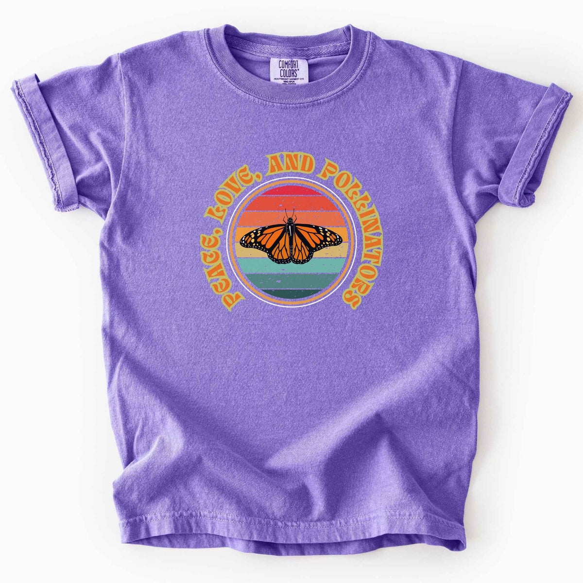 Violet "Peace, Love, and Pollinators" kids t-shirt on Comfort Colors tee, featuring a monarch butterfly against a retro rainbow sunset circle design. Butterfly gardener and native plant gift shirt for pollinator conservation fans.