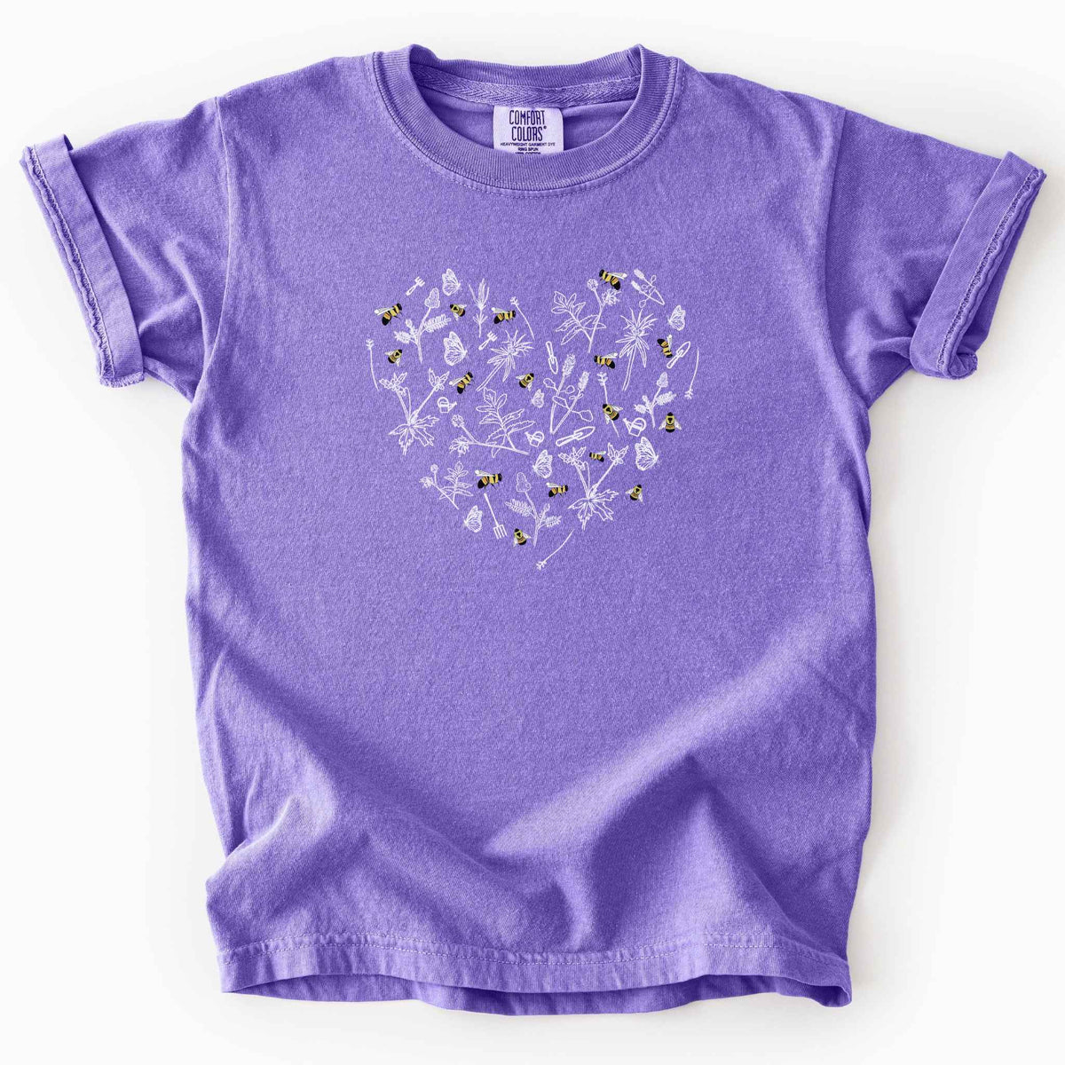Violet "Rusty Patch Bumblebee" kids t-shirt on Comfort Colors tee, featuring a heart shaped arrangement of hand-drawn white wildflowers, garden tools, butterflies, and colorful bees. Gardener and pollinator lover gift shirt for bee conservation and nature enthusiasts.