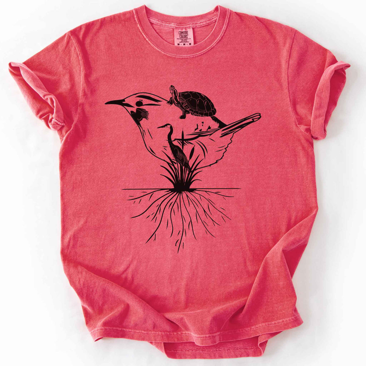 Watermelon "Marhlands Matter" t-shirt on Comfort Colors tee, featuring a surreal black line art style design blending a bird, turtle, heron, and cattail roots into one flowing wetland scene. Nature lover and wetland conservation gift shirt for birdwatching and wildlife enthusiasts.