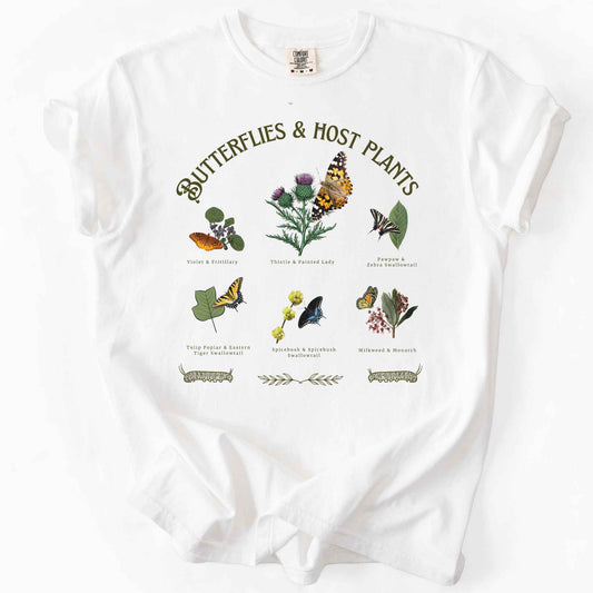 White "Butterflies & Host Plants" t-shirt on Comfort Colors tee, featuring six graphic designed butterfly and plant pairings including Monarch on Milkweed, Painted Lady on Thistle, and Eastern Tiger Swallowtail on Tulip Poplar. Botanical gift shirt for butterfly gardeners and nature lovers.