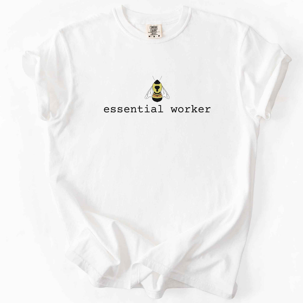 White "Essential Worker" t-shirt on Comfort Colors tee, featuring a small illustrated rusty patch bumblebee above simple typewriter style text. Funny bee lover and pollinator gift shirt for beekeepers and nature enthusiasts.