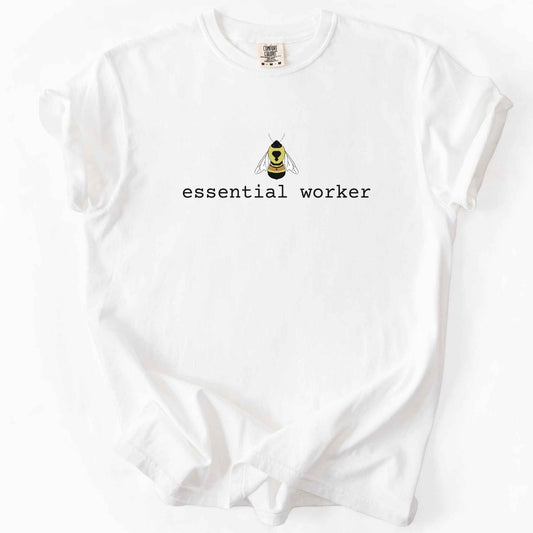 White "Essential Worker" t-shirt on Comfort Colors tee, featuring a small illustrated rusty patch bumblebee above simple typewriter style text. Funny bee lover and pollinator gift shirt for beekeepers and nature enthusiasts.