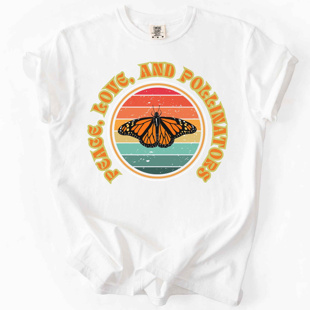 White "Peace, Love, and Pollinators" t-shirt on Comfort Colors tee, featuring a monarch butterfly against a retro rainbow sunset circle design. Butterfly gardener and native plant gift shirt for pollinator conservation fans.