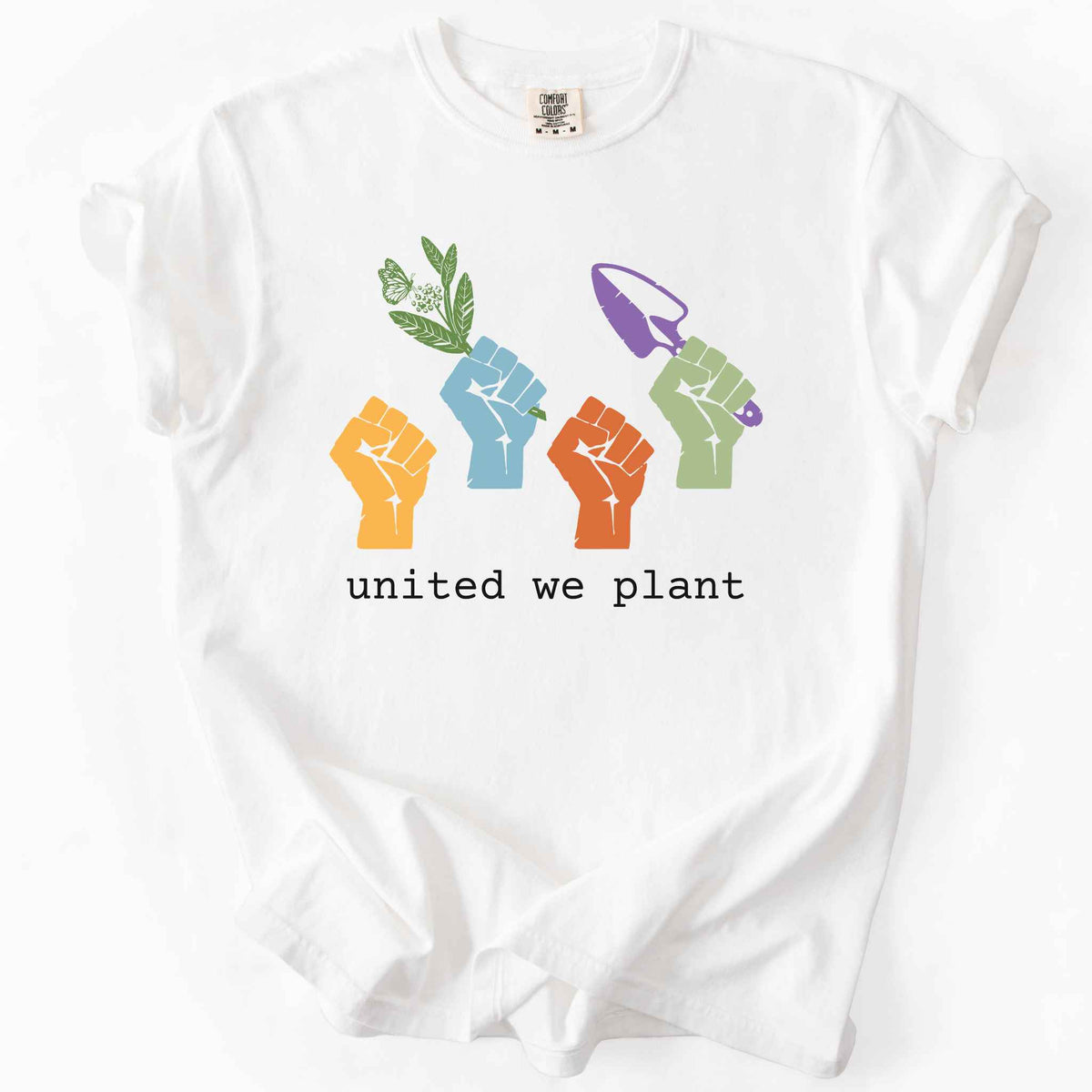 White "United We Plant" t-shirt on Comfort Colors tee, featuring four colorful raised fists, one holding a plant sprig and another a garden trowel, above bold black text. Gardener and native plant gift shirt for community garden and conservation enthusiasts.