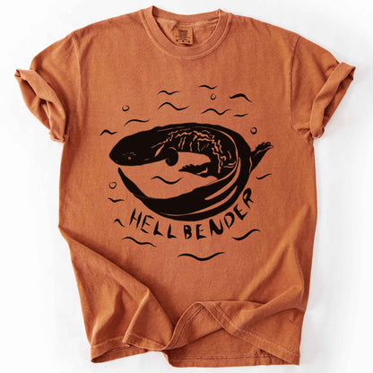 Yam "Hellbender" t-shirt on Comfort Colors tee, featuring a bold graphic of a curled hellbender salamander surrounded by stylized water splashes and bubbles. Amphibian and herpetology lover gift shirt for salamander and wildlife enthusiasts.