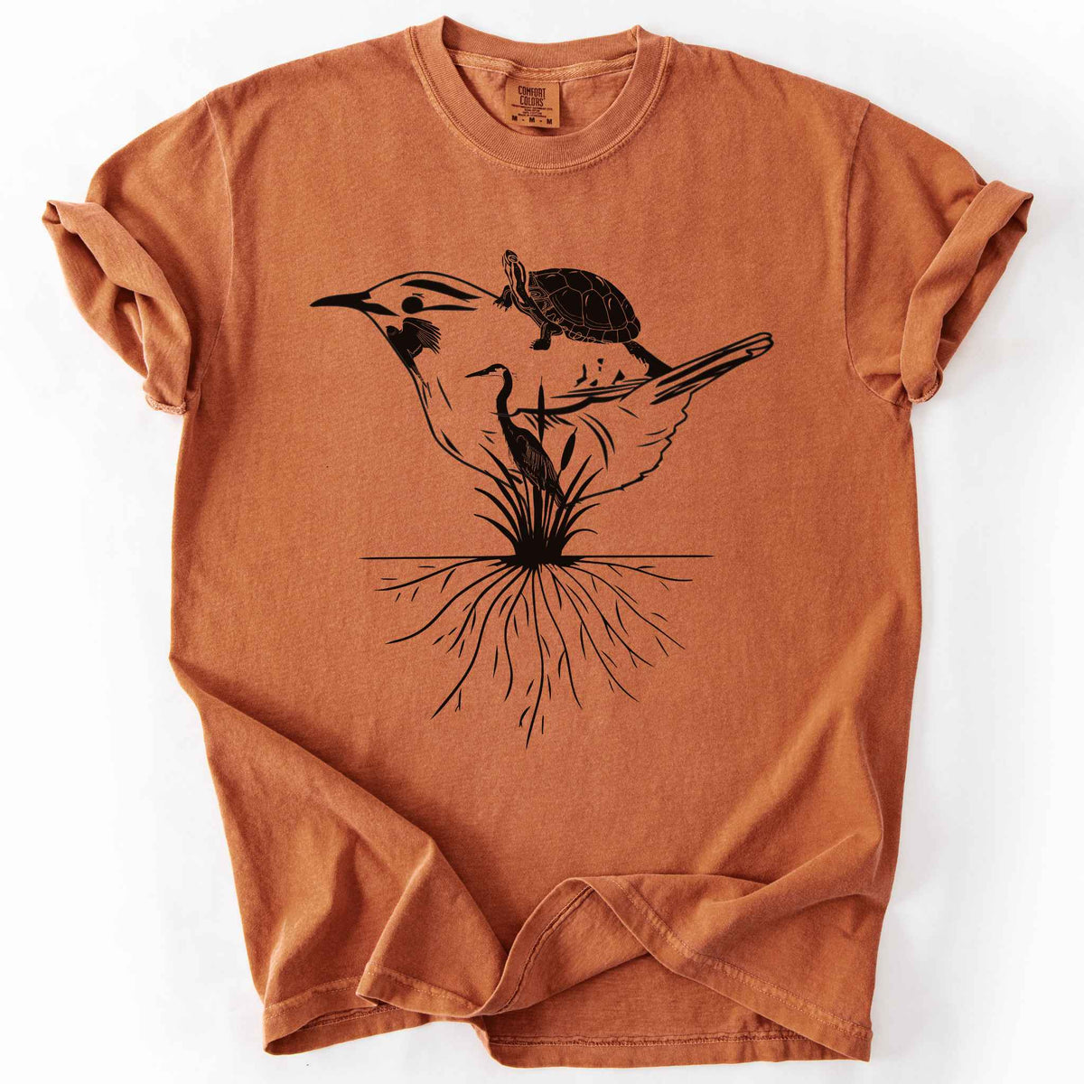 Yam "Marhlands Matter" t-shirt on Comfort Colors tee, featuring a surreal black line art style design blending a bird, turtle, heron, and cattail roots into one flowing wetland scene. Nature lover and wetland conservation gift shirt for birdwatching and wildlife enthusiasts.