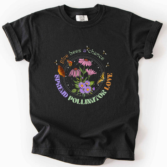 Black "Give Bees a Chance, Spread Pollinator Love" kids t-shirt on Comfort Colors tee, featuring colorful wildflowers, bees, and butterflies in a celestial circle design, gardener and nature lover gift shirt for bee and pollinator conservation fans.